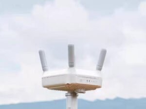 DJI AGRAS drone with Relay O4 RL02-65 signal relay module in field